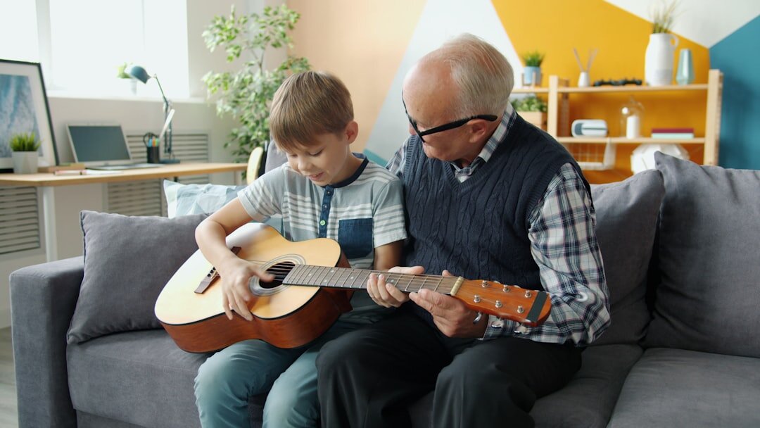 Senior man playing acoustic guitar