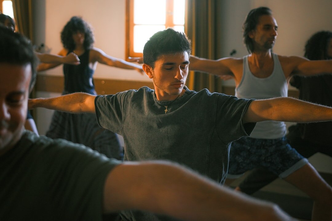 Diverse seniors stretching together during a group fitness class