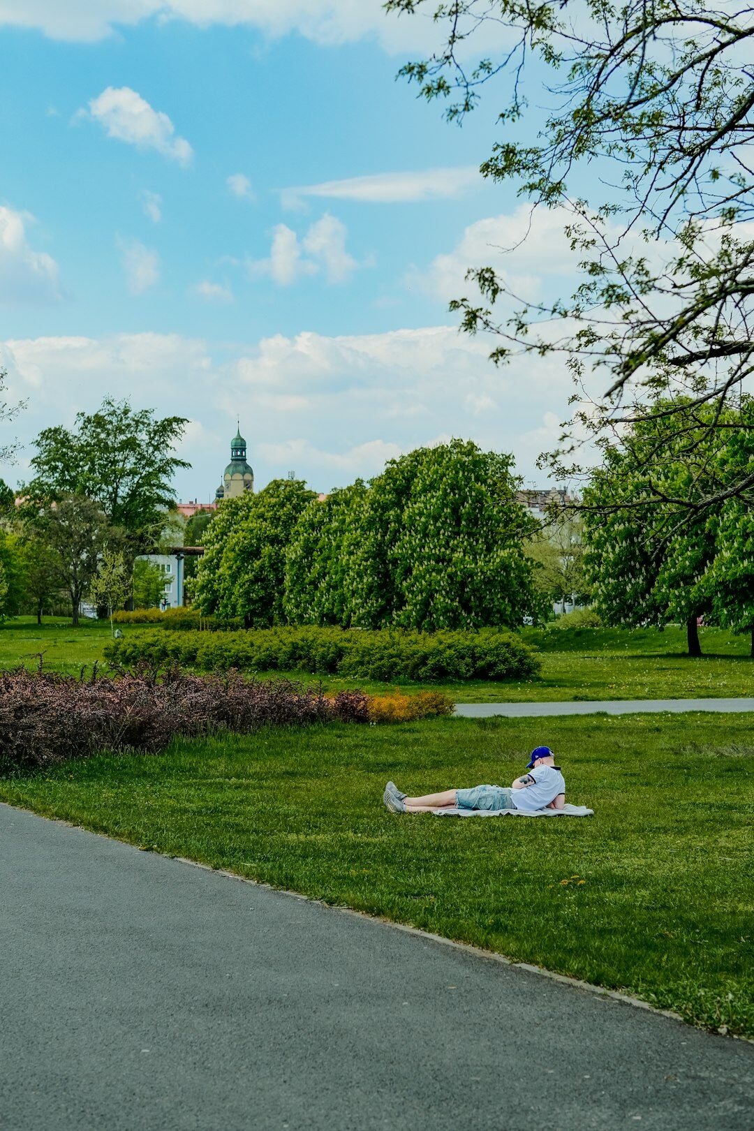 elderly woman meditating in park