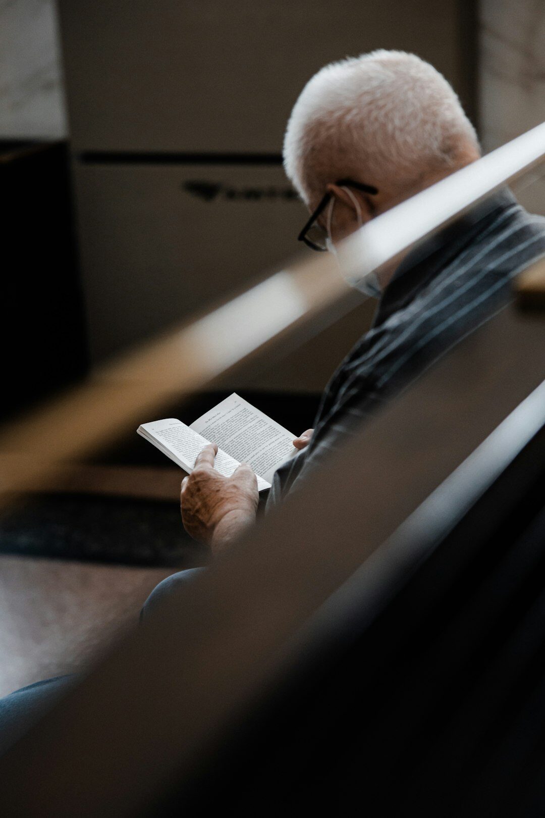 Senior man learning to use a tablet computer