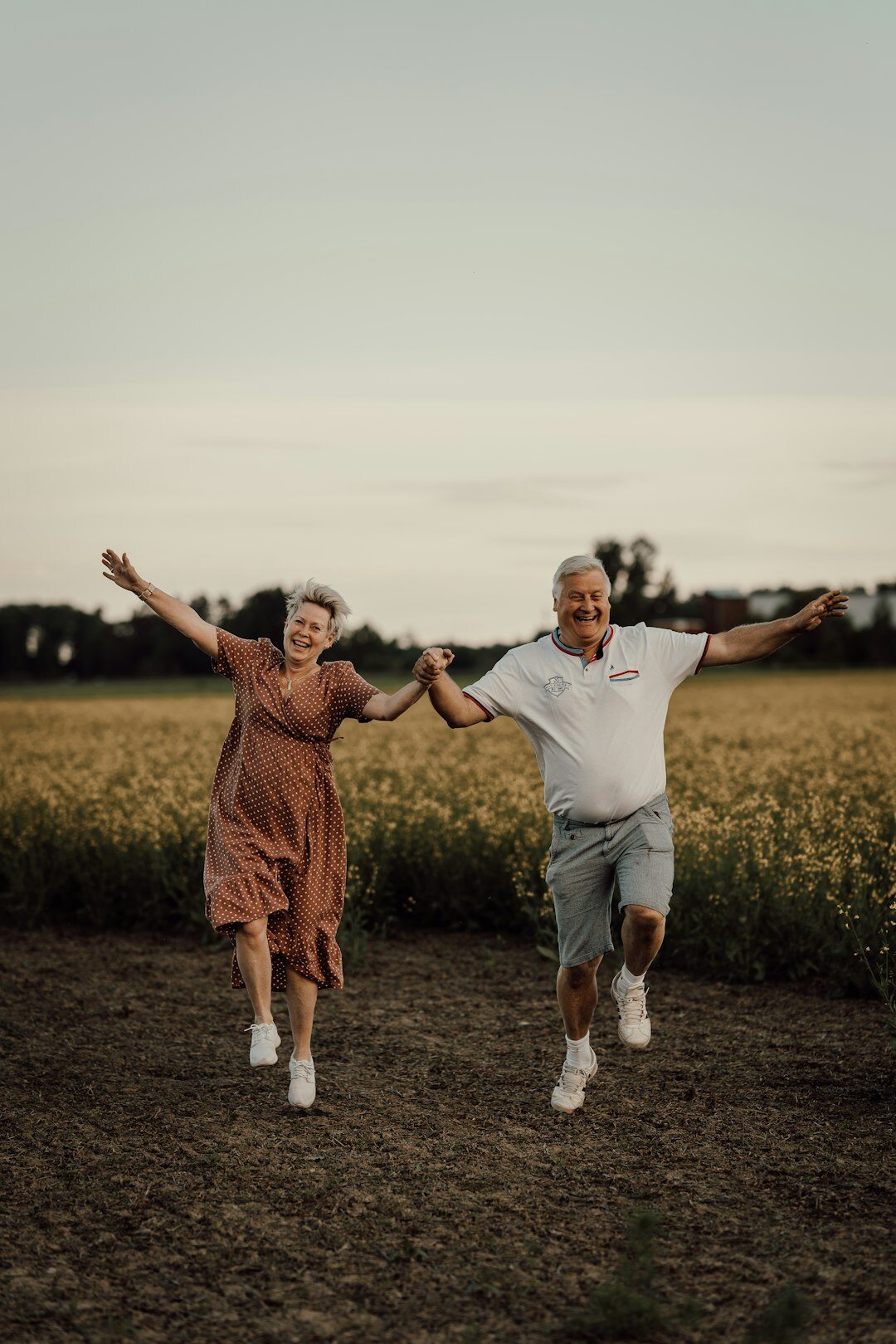 Senior couple dancing together and laughing